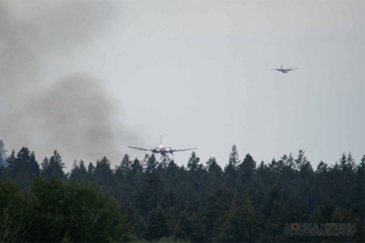 Fire bombers attack a fire near Springhouse, south west of Williams Lake. It was one of nine new fires to start in the Cariboo Fire Centre on June 20, and one of 50 across the province. Monika Petersen photo.