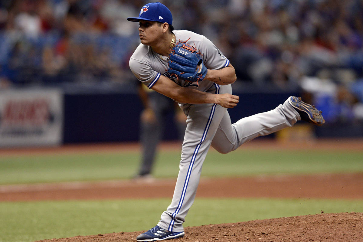FILE - In this May 6, 2018, file photo, Toronto Blue Jays relief pitcher Roberto Osuna throws during the ninth inning of a baseball game against the Tampa Bay Rays in St. Petersburg, Fla. Osuna has agreed to a suspension through Aug. 4 under baseball‚Äôs domestic violence policy, discipline that will cause him to miss about half of the season. (AP Photo/Jason Behnken, File)