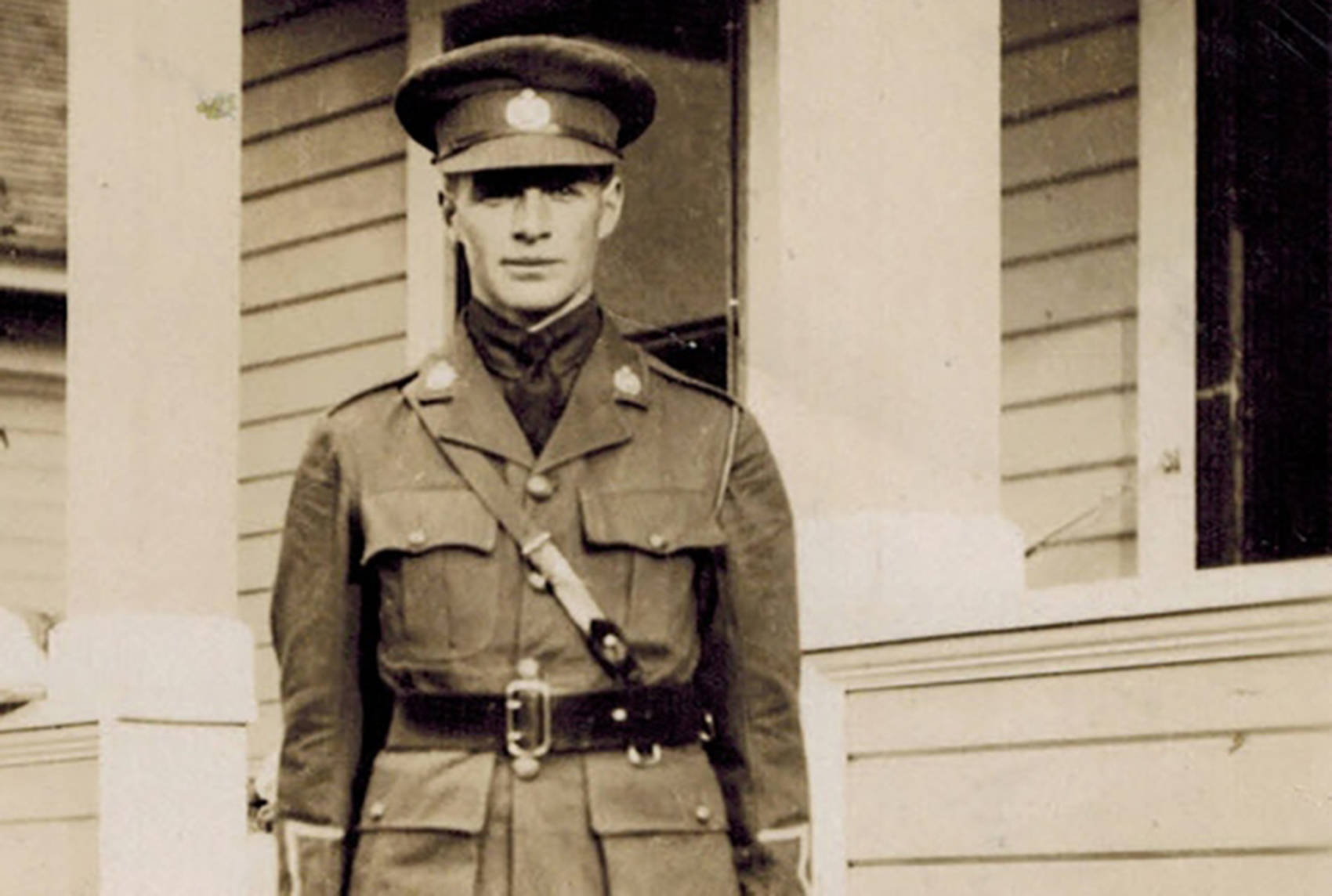 Norman Harper Stuart in military dress stands in front of a house in this undated photo contributed by his nephew, John Stuart Harper. (Contributed)