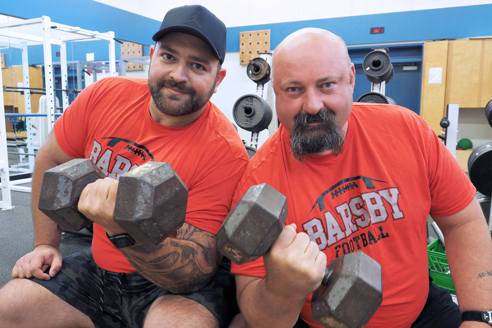 Curtis Vizza, left, and Rob Stevenson, who coach football and teach at John Barsby Secondary School, are the masterminds behind the school’s new Mastery and Performance program that will teach students physical literacy. (CHRIS BUSH/The News Bulletin)