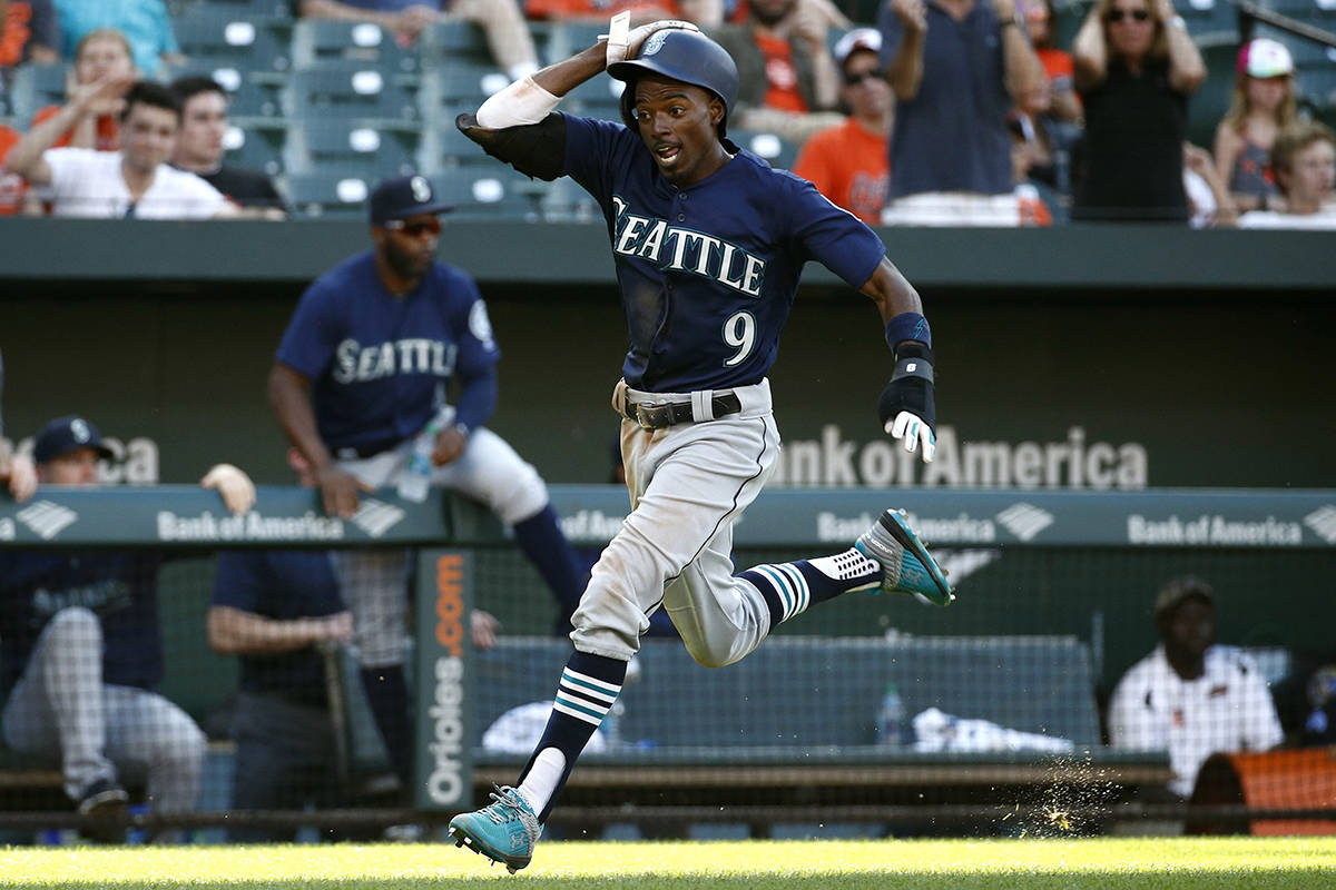 Seattle Mariners’ Dee Gordon scores a run on a single by Jean Segura in the 10th inning of a baseball game against the Baltimore Orioles, Thursday, June 28, 2018, in Baltimore. Seattle won 4-2 in 10 innings. (AP Photo/Patrick Semansky)