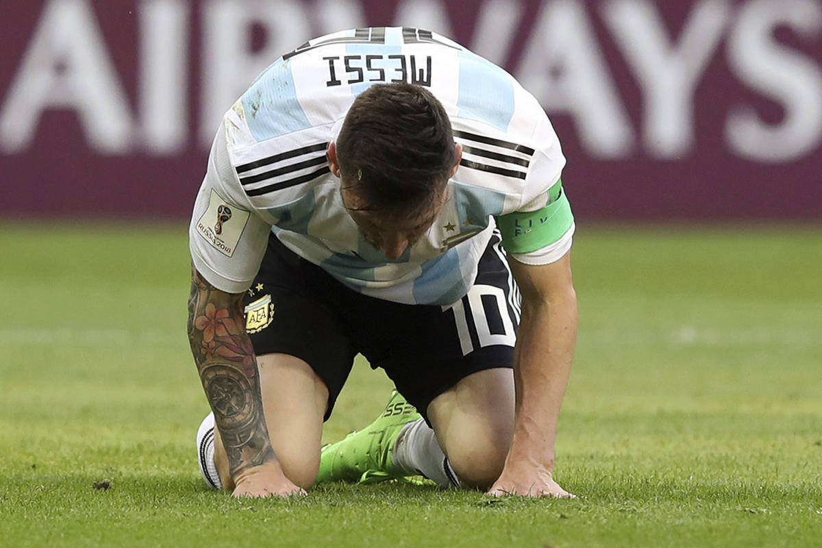 Argentina’s Lionel Messi kneels on the pitch during the round of 16 match between France and Argentina, at the 2018 soccer World Cup at the Kazan Arena in Kazan, Russia, Saturday, June 30, 2018. (AP Photo/Thanassis Stavrakis)