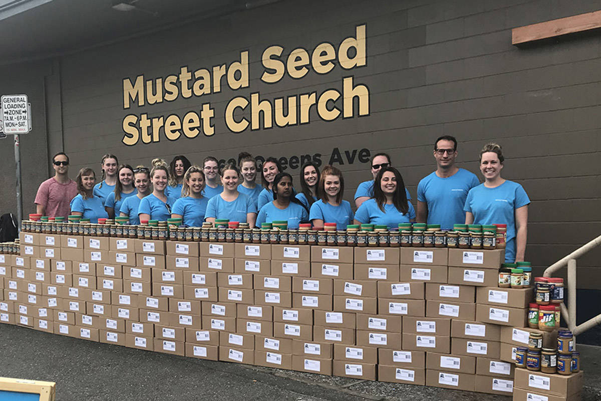 Merry Maids and Island Nut Roastery donated 2,400 jars of peanut butter to the Mustard Seed food bank. File contributed