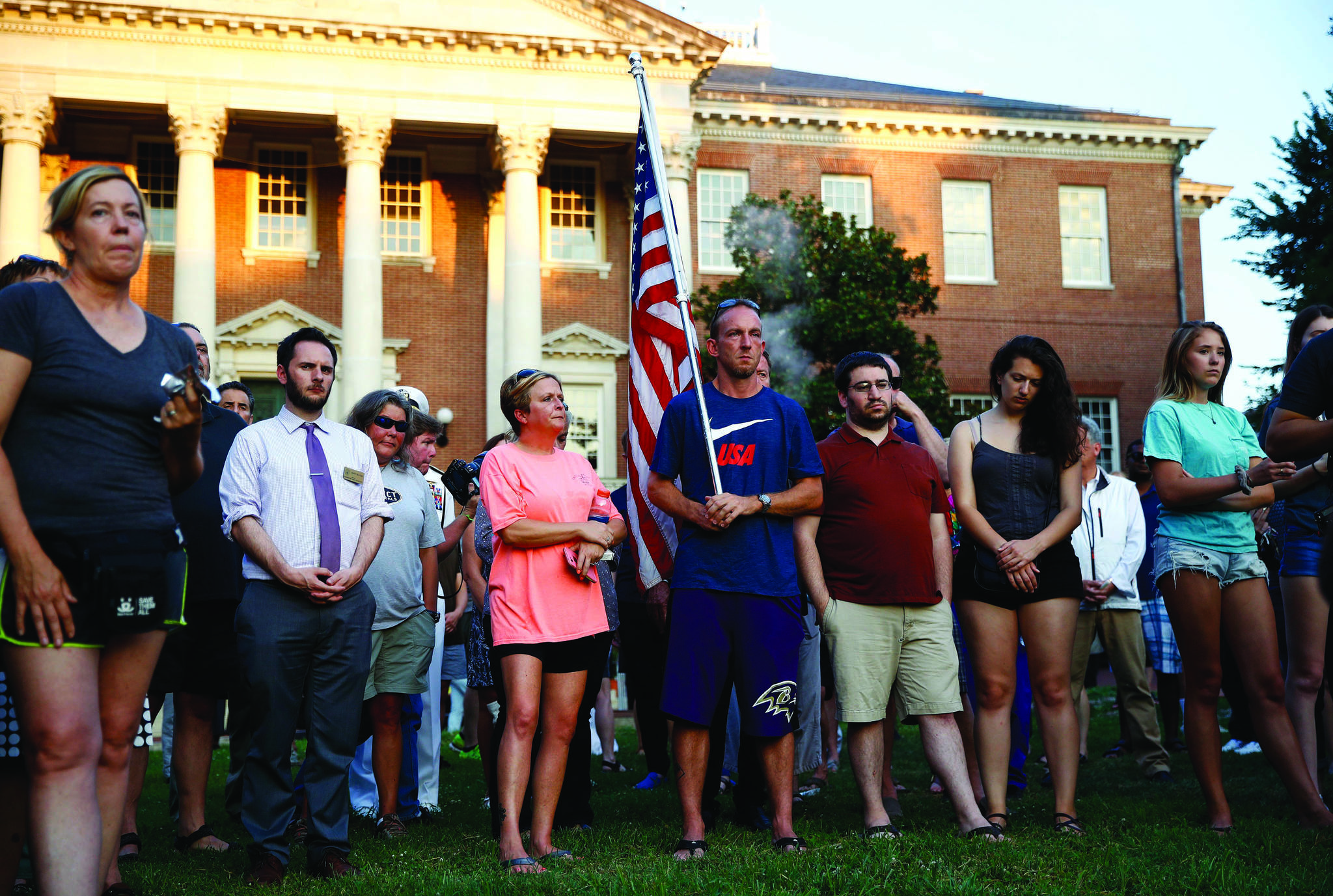 People gather for a vigil in response to a shooting at the Capital Gazette newsroom, Friday, June 29, 2018, in front of the Maryland State House in Annapolis, Md. Prosecutors say Jarrod W. Ramos opened fire Thursday in the newsroom. (AP Photo/Patrick Semansky)