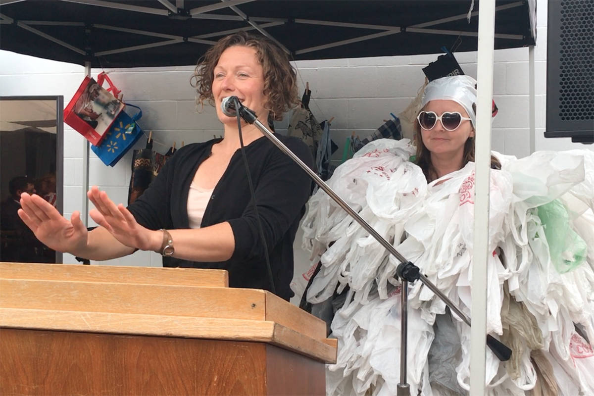 Rachael Montgomery, left, chair of the Surfrider Foundation’s Victoria chapter, is joined by a counterpart in a plastic bag dress that was officially retired last week at a gathering to honour winners of the City of Victoria’s BYOBag video contest. The new City bylaw banning single-use plastic bags is now in effect, but merchants have a six-month grace period to use up what bags they have in stock before risking fines for providing plastic bags to customers. Don Descoteau/Victoria News