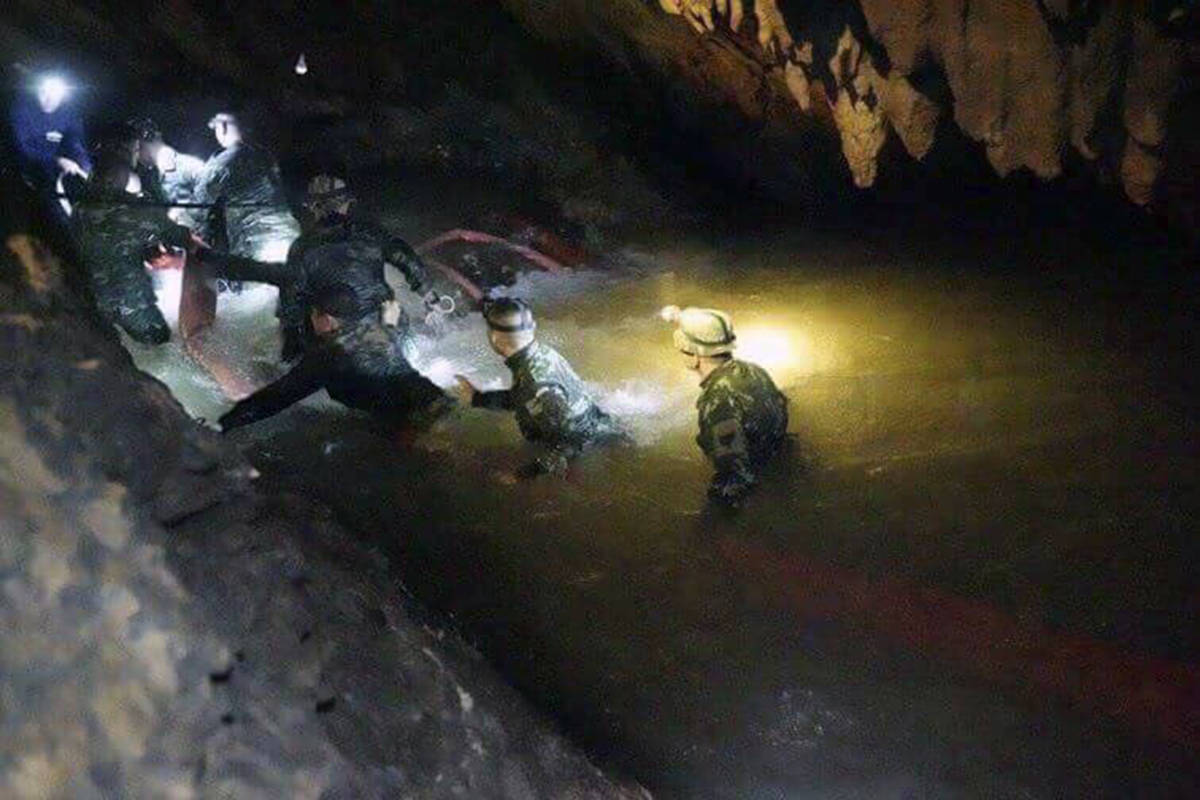 Rescuers in Thailand make their way toward where a young soccer team has been trapped by rising waters in a cave for more than week. (File photo)