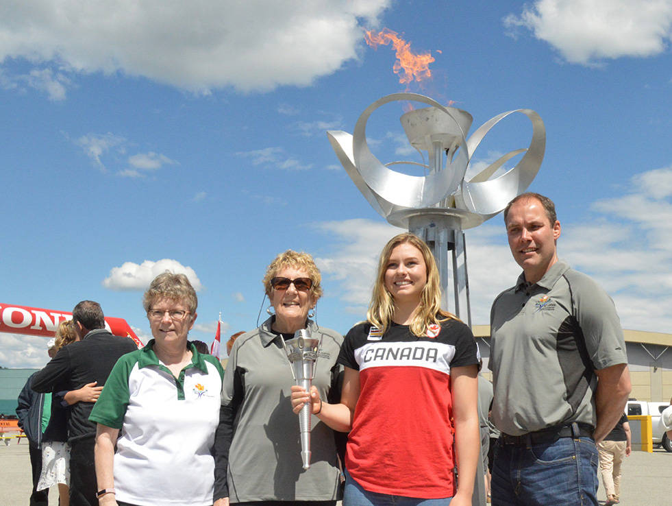 Nancy Loucks from Mission concentrated on her target during archery competition in Langley City Park during the 2014 games. The Township is considering applying to host the 55+ BC Games in 2020, 2021 or 2022. Langley Times file photo                                The torch was lit in Cranbrook to launch the countdown to the Kimberley/Cranbrook 2018 BC 55+ Games, Sunday, June 17, in Balment Park. The Kimberley/Cranbrook 2018 55+ BC Games will take place Sept. 11-15, with sports being held in venues throughout Cranbrook and Kimberley. Over 2,800 participants are expected to compete in 23 sports. Left to right: Cindy Simpson, President of the BC Seniors Games Society; Sandy Zeznk, Joint President of the BC+ Games Host Society; India Sherrit, Cranbrook Olympic Ski-crosser and torch bearer; Jaret Thompson, Joint President of the BC+ Games Host Society. Barry Coulter photo