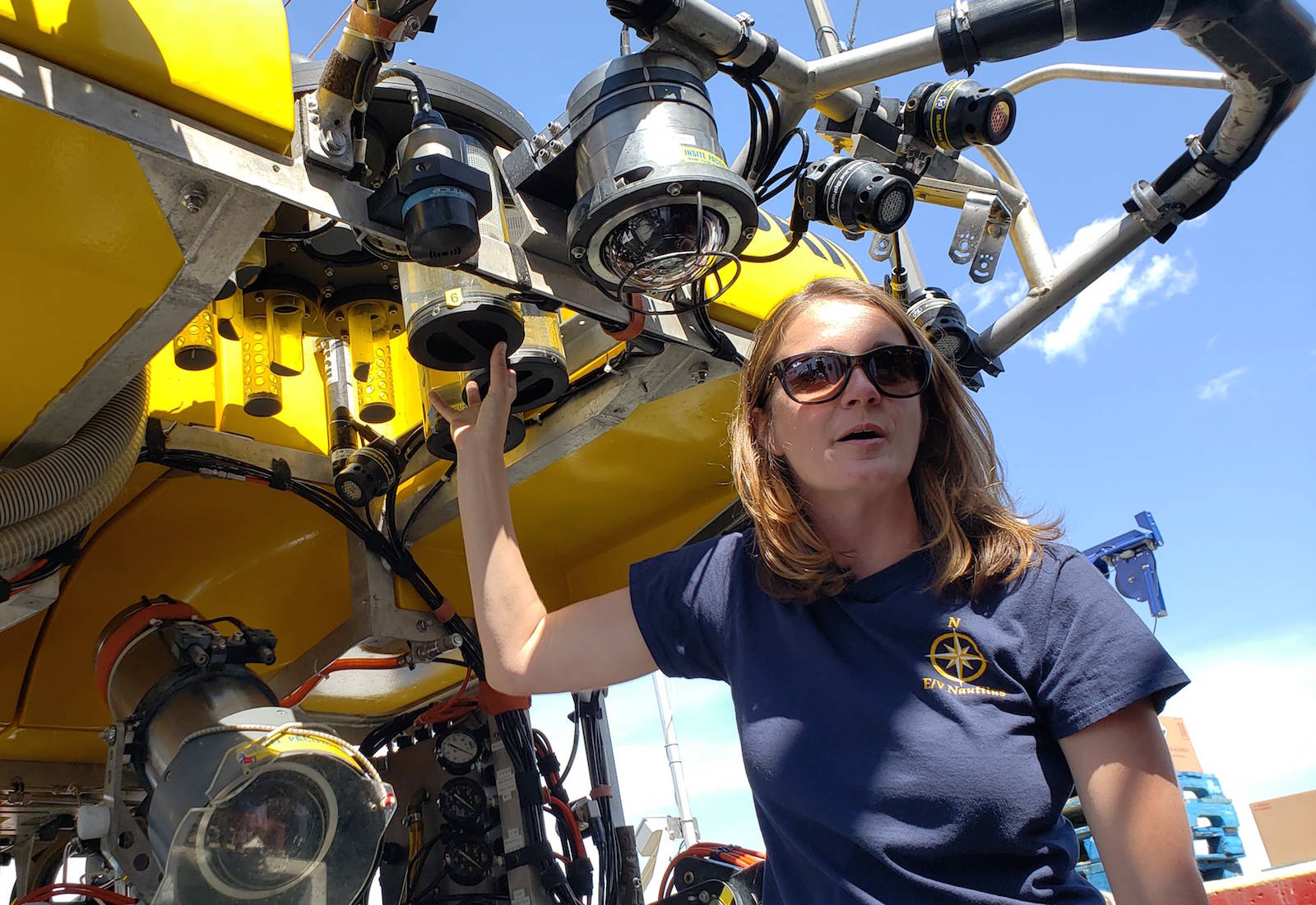 Allison Fundis of the Ocean Exploration Trust gives reporters a tour of the remotely operated vehicle Hercules, used to explore the deep ocean. (Hugo Wong/News Staff)