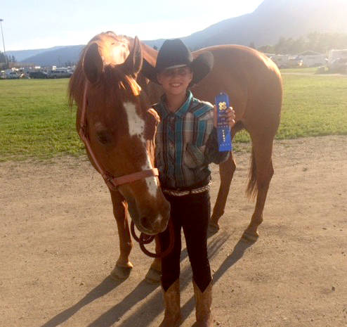 Addie Beaudoin and Pretty Boy display their blue ribbon earned at the 4H Okanagan Stock Show last weekend in Armstrong. (Submitted Photo)