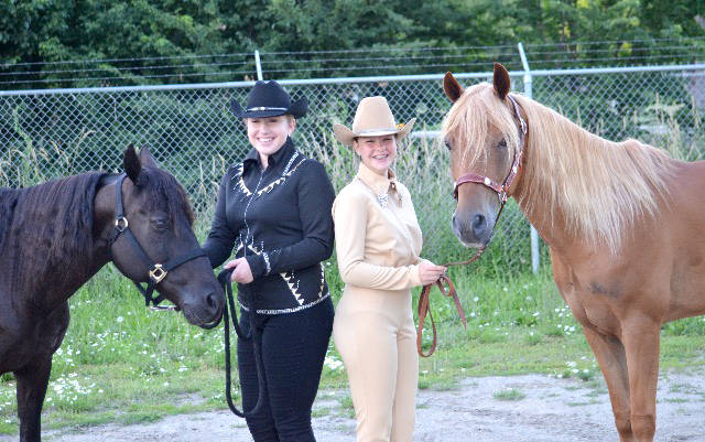 Lillian Batten (left) with Noble-T-Rosaleta and Abby McLuskey with Noble-T-Remington are dressed for success at the horse show last weekend in Armstrong during the BC 4H Okanagan Stock Show. (Submitted photo)