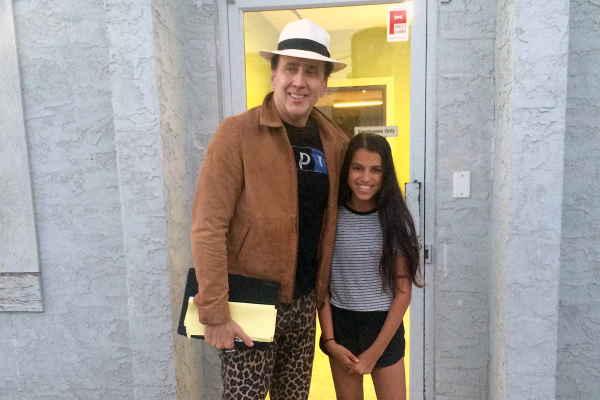Actor Nicolas Cage meets Kennedy Mund of Vernon after shooting a movie scene at Grillers Meats in downtown Vernon Friday. (Photo Submitted)
