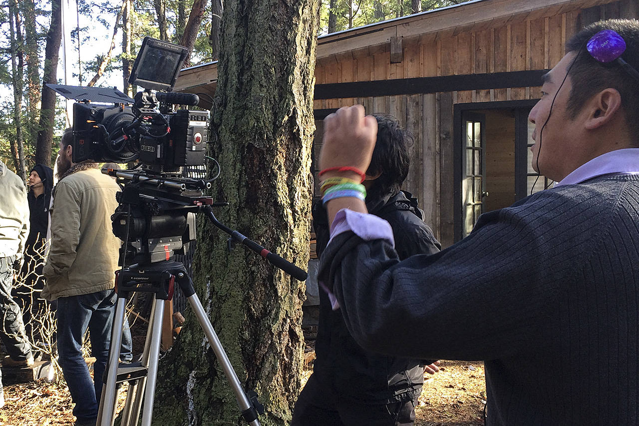Director Arnold Lim takes a look at the shot on the set of the All-in Madonna short film shot on Piers Island in November 2017. (Photo by Robyn Thomas)