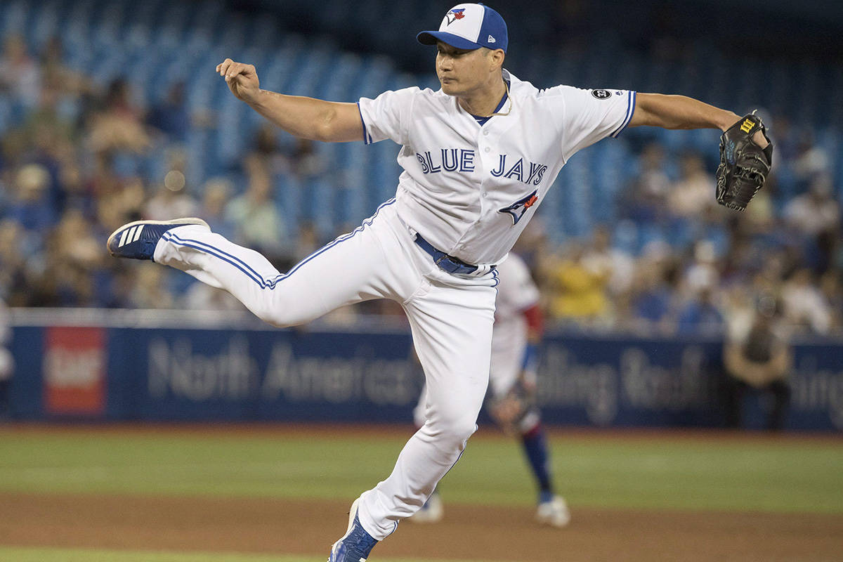 Toronto Blue Jays pitcher Seunghwan Oh throws against the Minnesota Twins in the ninth inning of their American League MLB baseball game in Toronto on Tuesday July 24, 2018. THE CANADIAN PRESS/Fred Thornhill