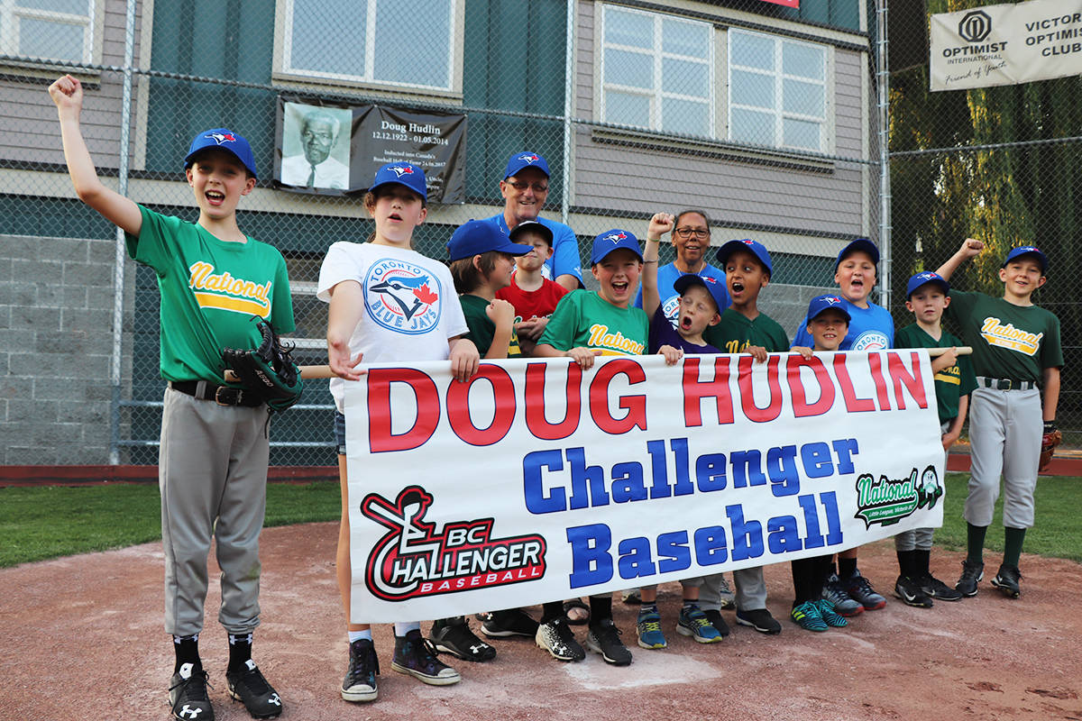 Players and volunteers at National Little League celebrate the Doug Hudlin Challenger Baseball program, which received a $15,000 grant from the Jays Care Foundation for dugout improvements at the park relating to accessibility, security and weatherproofing. Don Descoteau/Victoria News