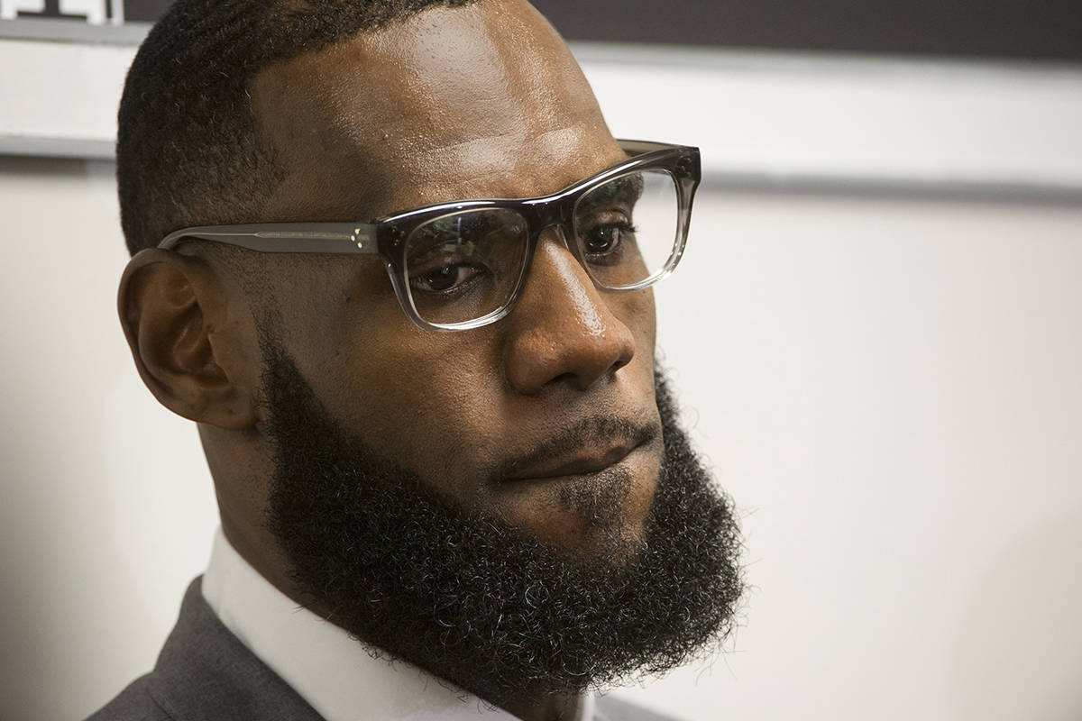 FILE - In this July 30, 2018 file photo LeBron James listens to a question at a news conference after the opening ceremony for the I Promise School in Akron, Ohio. President Donald Trump is turning his wrath on the basketball superstar. Trump tweeted late Friday, Aug. 3 that James was interviewed “by the dumbest man on television,” CNN anchor Don Lemon, but that he “made Lebron look smart, which isn’t easy to do.”(AP Photo/Phil Long, File)