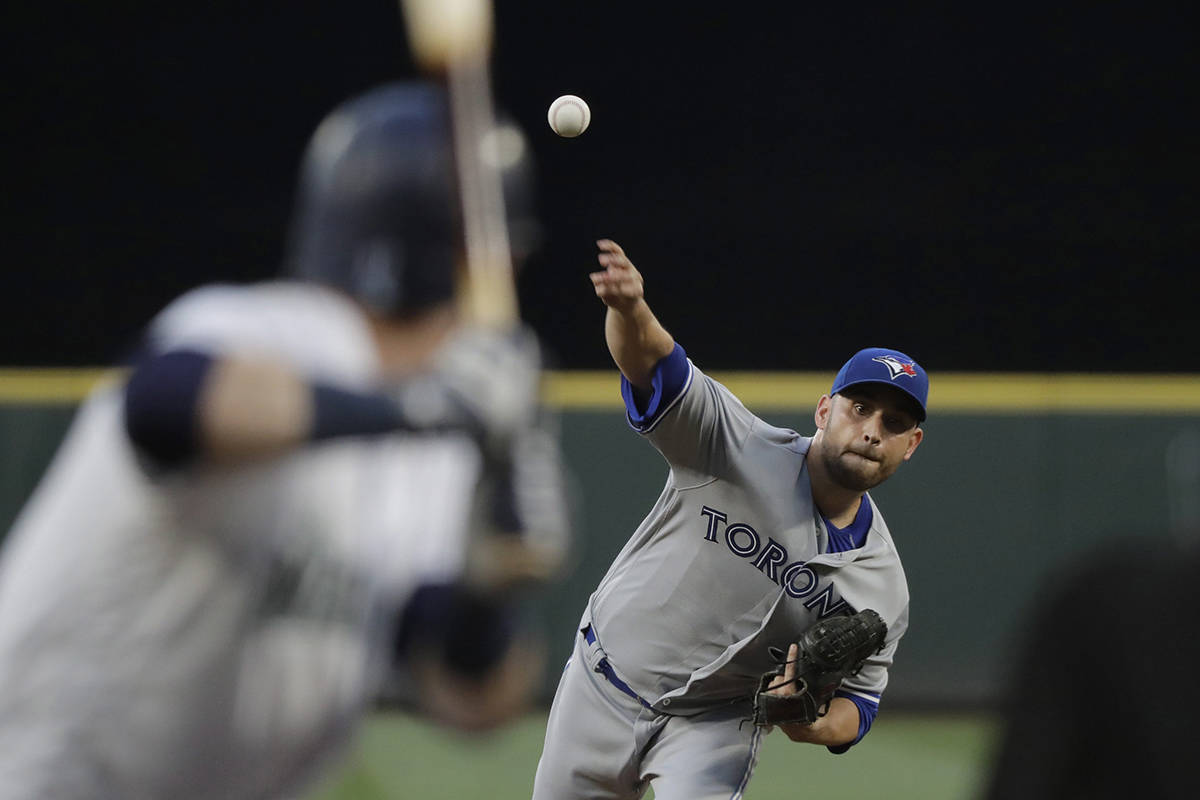 Toronto Blue Jays starting pitcher Marco Estrada throws against the Seattle Mariners during the fourth inning of a baseball game Saturday, Aug. 4, 2018, in Seattle. (AP Photo/Ted S. Warren)