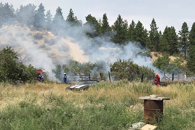 Members of the Penticton Indian Band fire department and Penticton Fire Department put out a grassfire on Friday afternoon. Kristi Patton/Western News