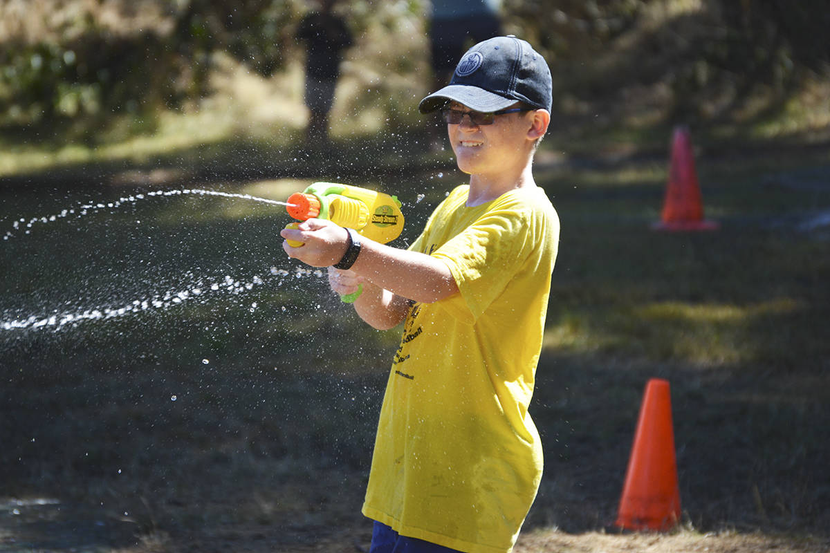 The annual water gun battle at Fort Rodd Hill is regularly a hit for kids, but it also allows some parents to relive their youth. This year’s event, featuring more than just water guns, takes place Aug. 18. (Gazette file photo)