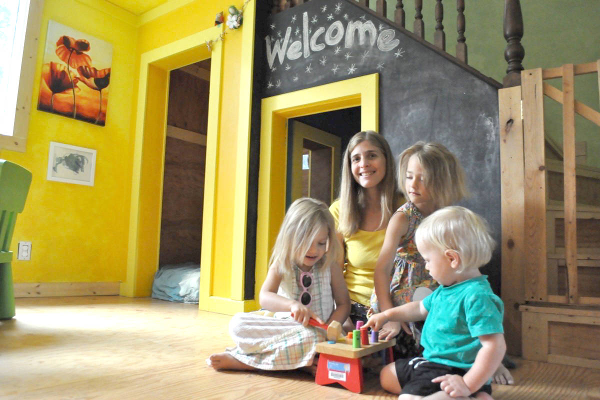 Bonnington Blossoms operator Kathy Sager, seen here in her home with her children Ayla and Anduin as well as Ruben Rustemeyer, says provincial funding for certain child care centres is lower than it should be. Photo: Tyler Harper