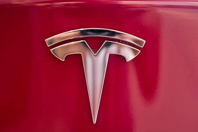 A Tesla emblem is seen on the back end of a Model S in the Tesla showroom in Santa Monica, Calif., on Wednesday, Aug. 8, 2018. THE CANADIAN PRESS/AP-Richard Vogel