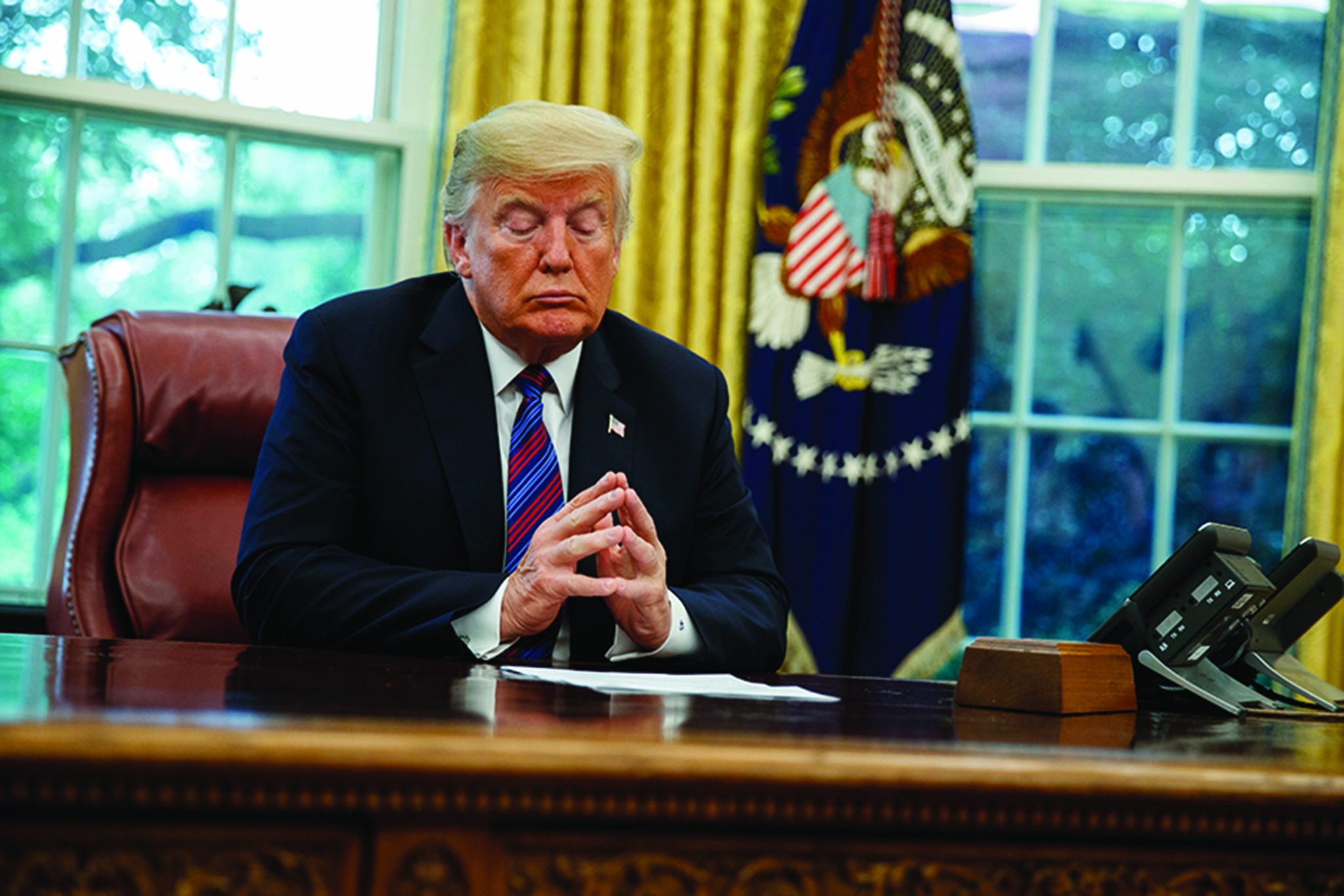 President Donald Trump listens during a phone call with Mexican President Enrique Pena Nieto about a trade agreement between the United States and Mexico, in the Oval Office of the White House, Monday, Aug. 27, 2018, in Washington. (AP Photo/Evan Vucci)