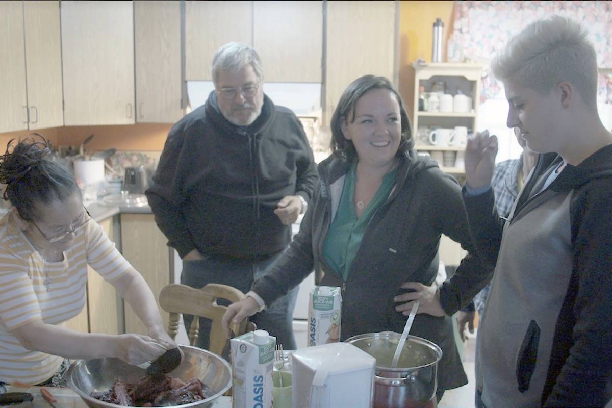 Avonlea Collins (centre) tries seal for the first time. Collins, along with five others, spent 28 days travelling across Canada with a camera crew meeting Indigenous people from a variety of different cultures. APTN’s “First Contact” airs Sept. 11, at 7 p.m. (Submitted)