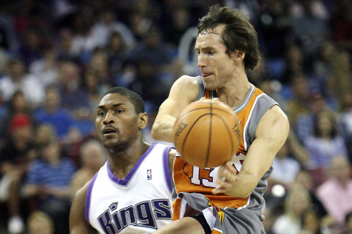 In this March 25, 2007, file photo, Phoenix Suns guard Steve Nash, right, drives around Sacramento Kings defender Ron Artest during the first half of an NBA basketball game in Sacramento, Calif. Nash, Jason Kidd and Grant Hill are among the 13-member class that will be inducted into the Basketball Hall of Fame in September, the Hall of Fame announced Saturday, March 31, 2018. (AP Photo/Steve Yeater, File)