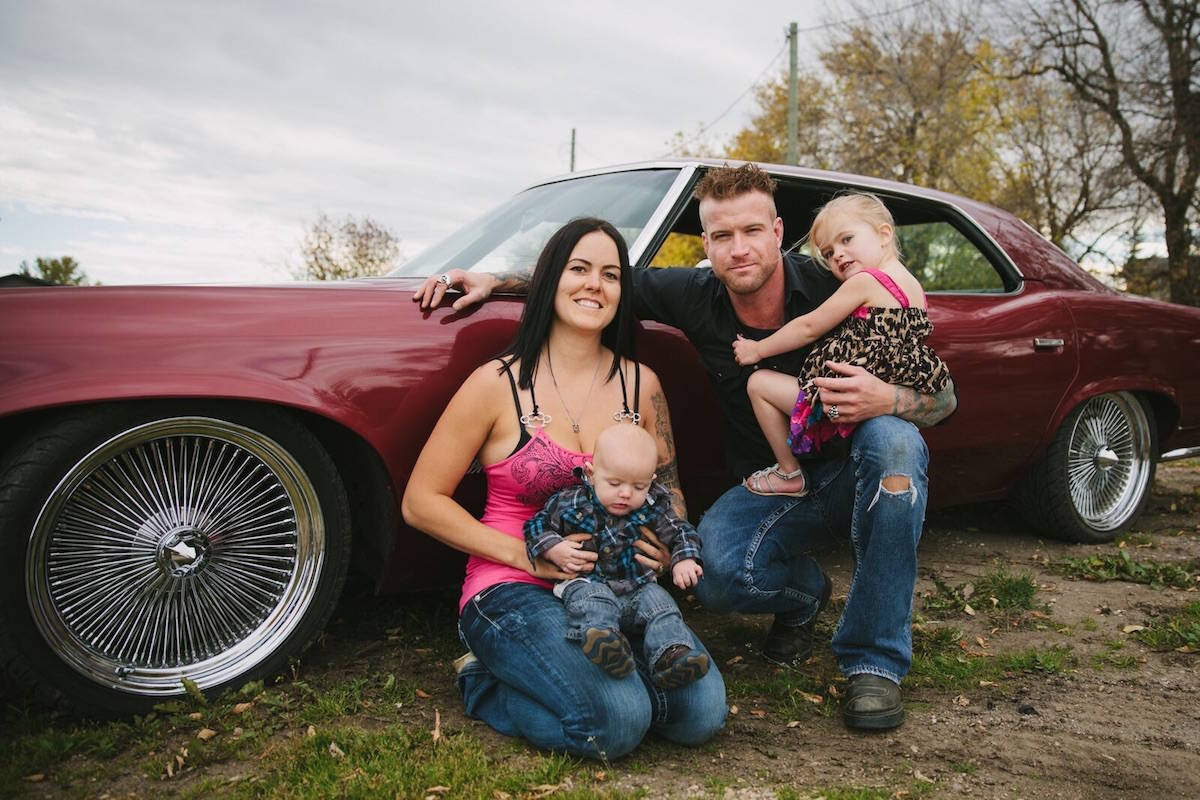 A picture of happier times — Brent and Nicole Keryluke and their children with the 1973 Pontiac Parisienne. (Contributed photo).