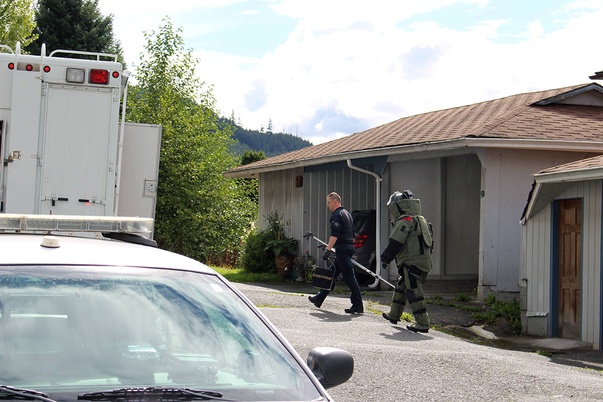 RCMP were on the scene in blast suits investigating the victim’s residence in Port Alice on Wednesday, Sept. 12. Photo by Thomas Kervin/Black Press