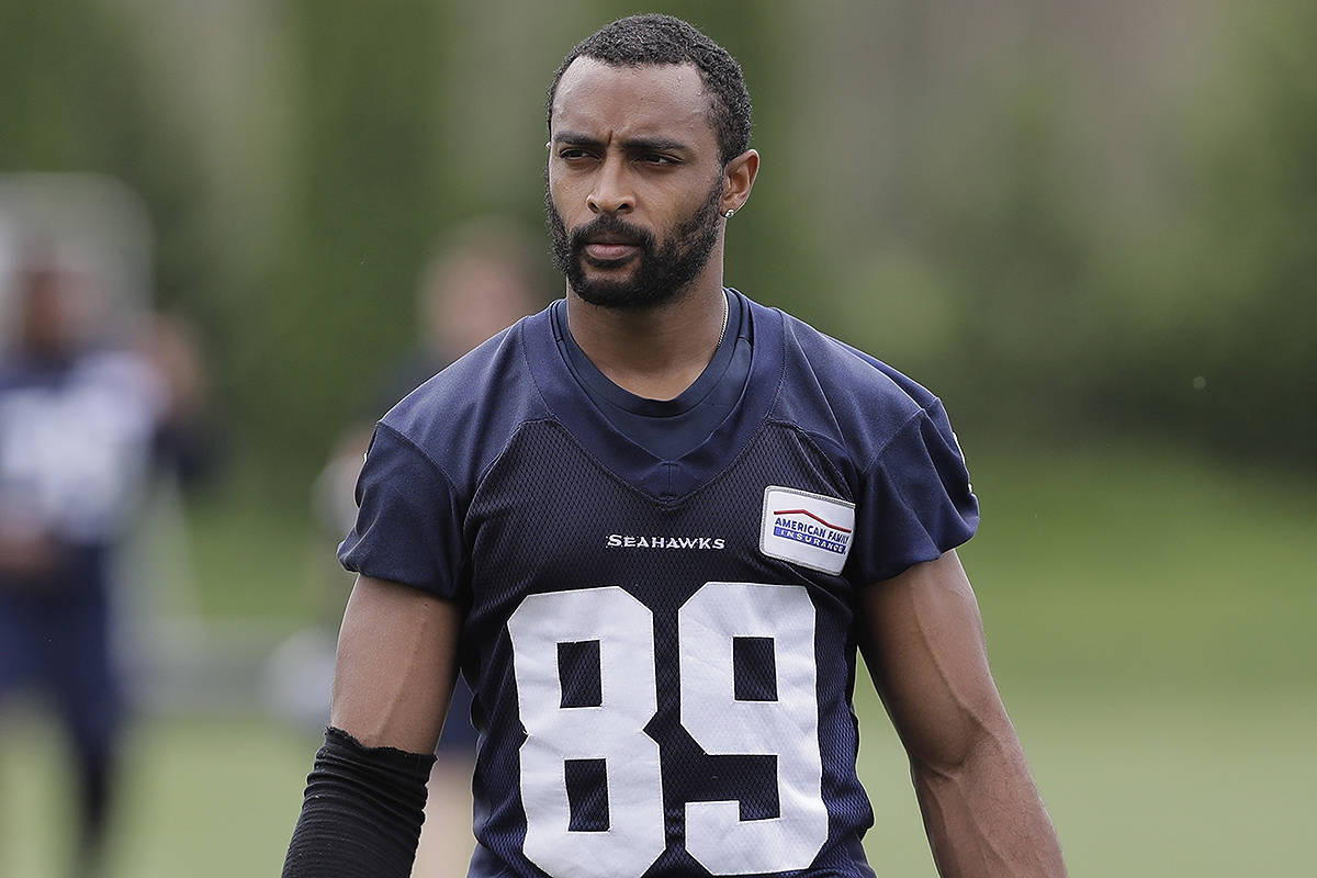 FILE - In this May 24, 2018, file photo, Seattle Seahawks wide receiver Doug Baldwin walks off the field following NFL football practice, in Renton, Wash. Baldwin is back practicing for the Seattle Seahawks in the hope he can return in Week 4 vs. Arizona after sitting out with a sprained knee. (AP Photo/Ted S. Warren, File)
