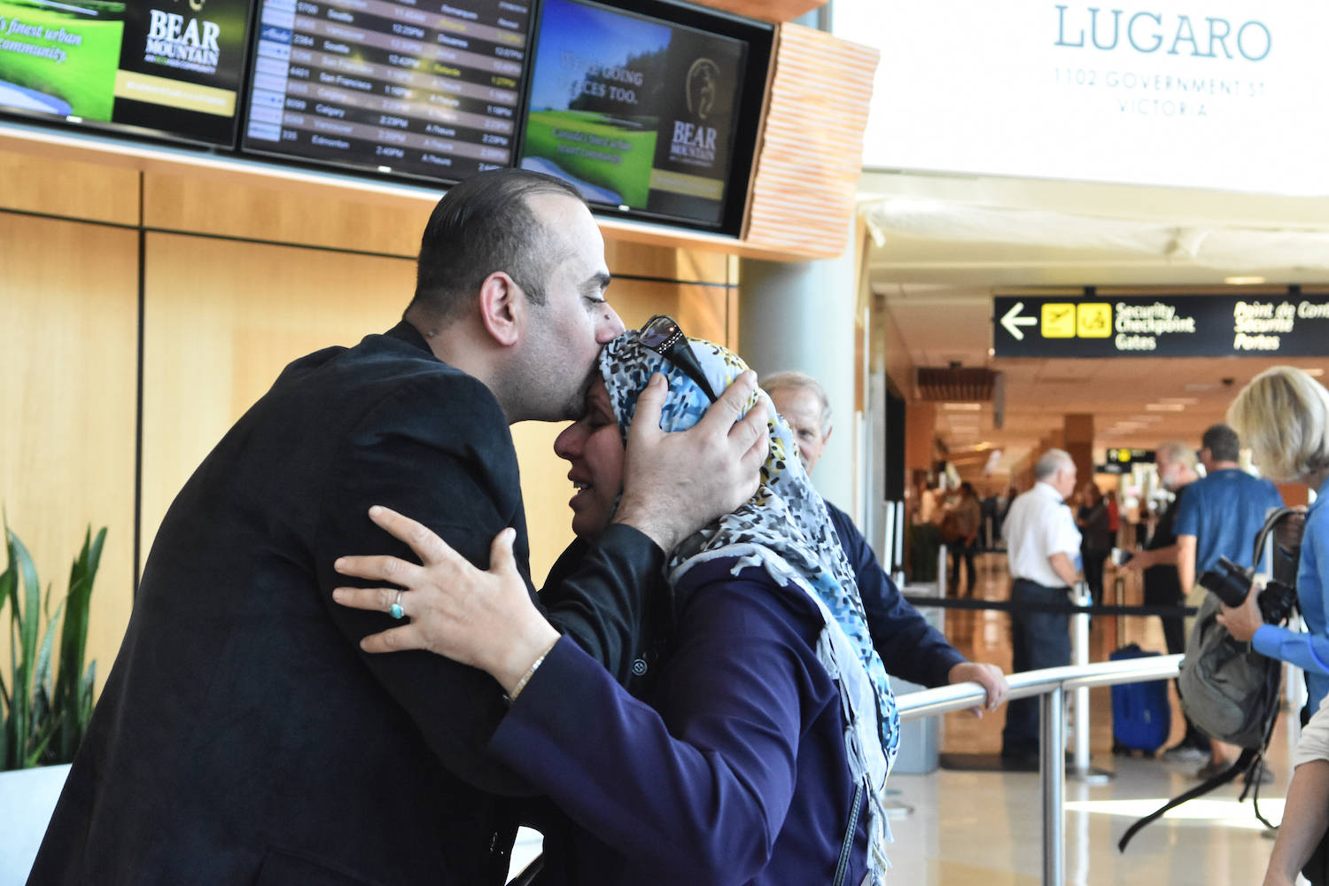 Refugee family reunites at Victoria airport