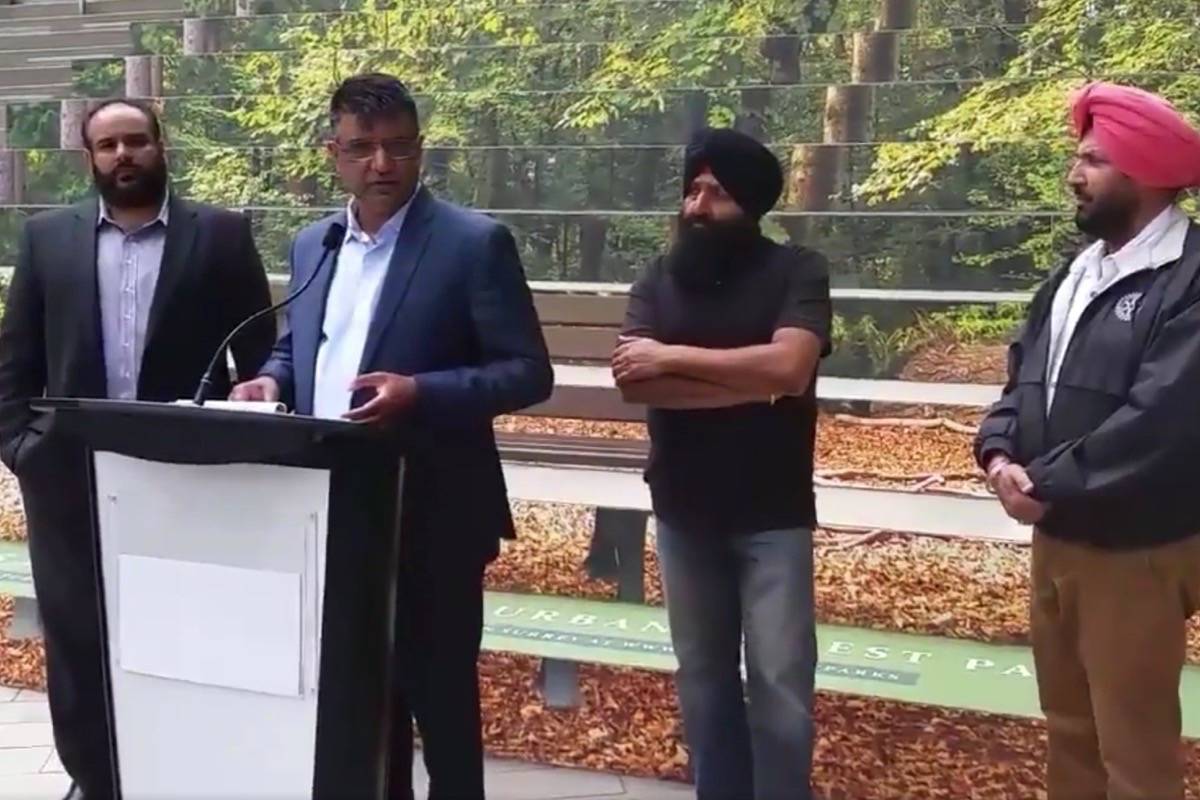 Sukhi Sandhu, at podium, reveals Wake Up Surrey’s recommendations to fight gang violence in this city. (Photo: Tom Zytaruk)