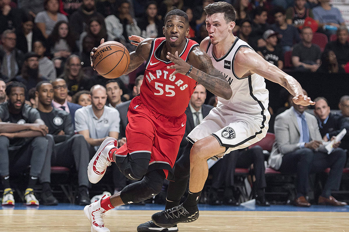 Toronto Raptors’ Delon Wright, left, drives to the basket as Brooklyn Nets’ Rodions Kurucs defends during first half NBA pre-season basketball action in Montreal, Wednesday, October 10, 2018. THE CANADIAN PRESS/Graham Hughes