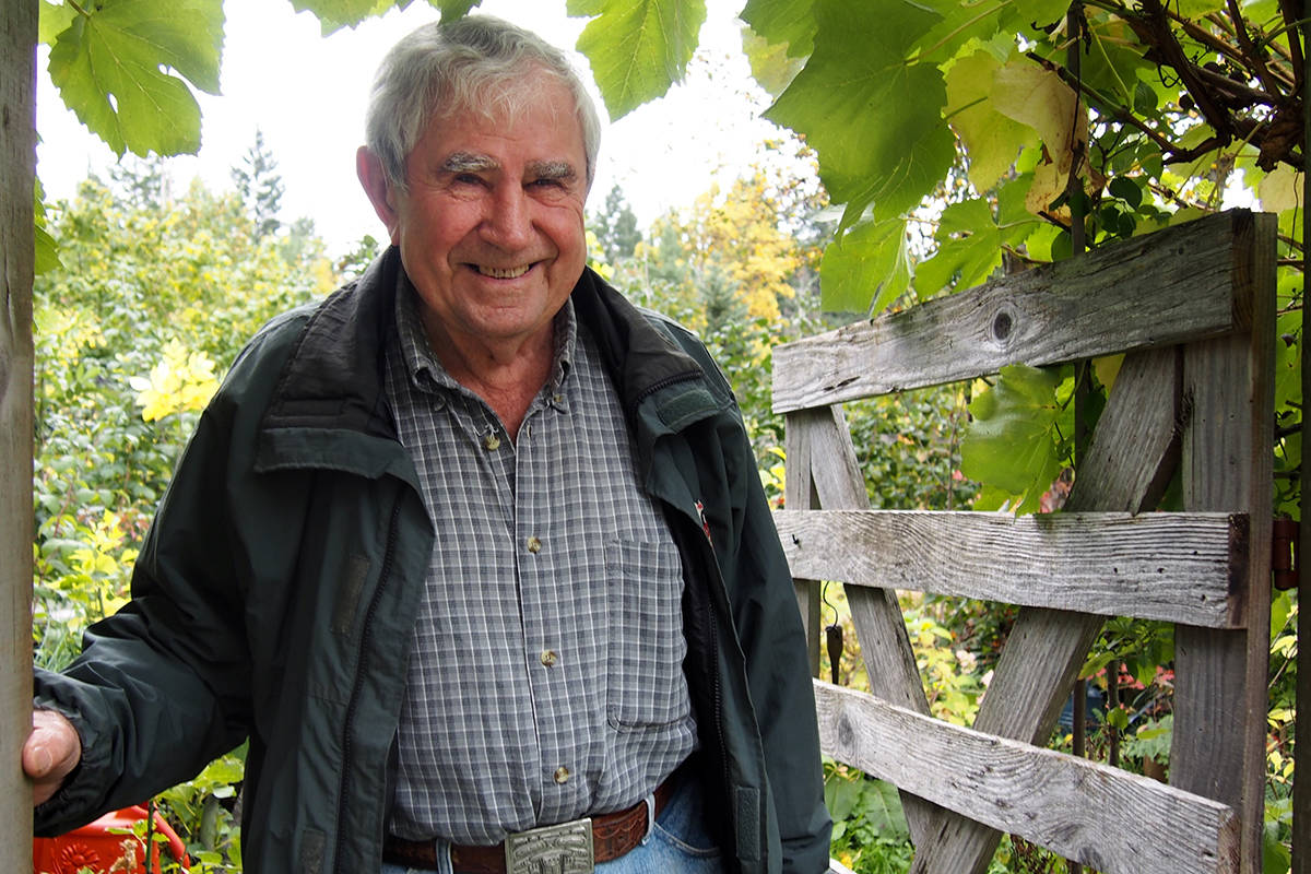 Mike Kokura at his garden gate in the Beaufort hills above Port Alberni. MIKE YOUDS PHOTO