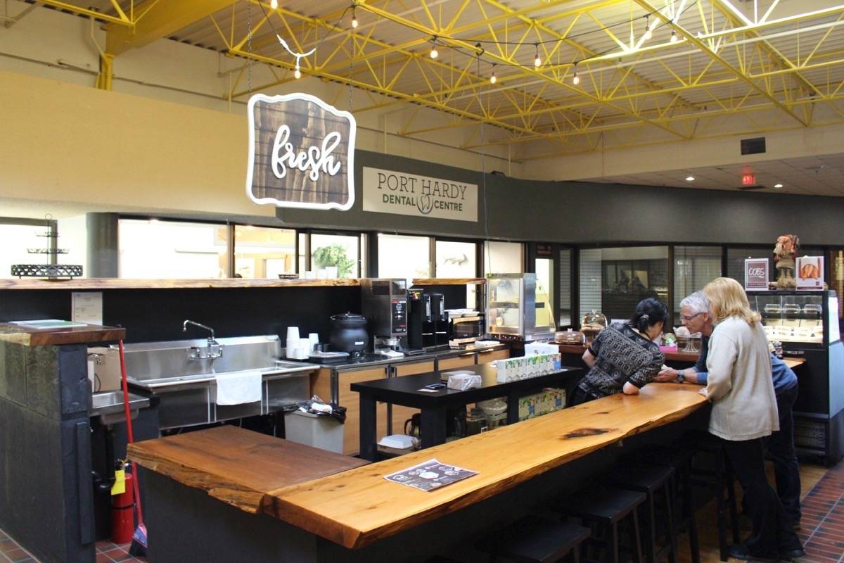 THOMAS KERVIN PHOTO                                A Fresh Coffee and Nosh barista serves a local during the afternoon.