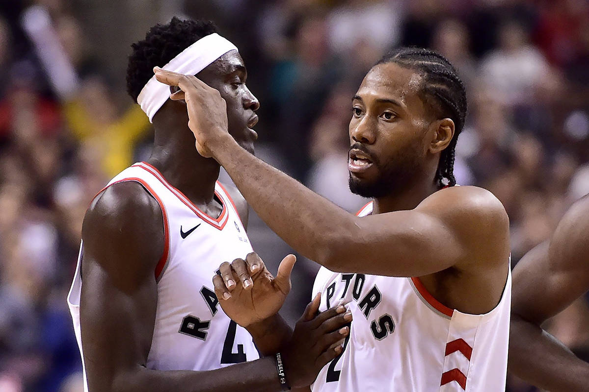Toronto Raptors forward Kawhi Leonard (2) and teammate Pascal Siakam (43) celebrate their team’s win following second half NBA basketball action against the Dallas Mavericks, in Toronto on Friday, Oct. 26, 2018. THE CANADIAN PRESS/Frank Gunn