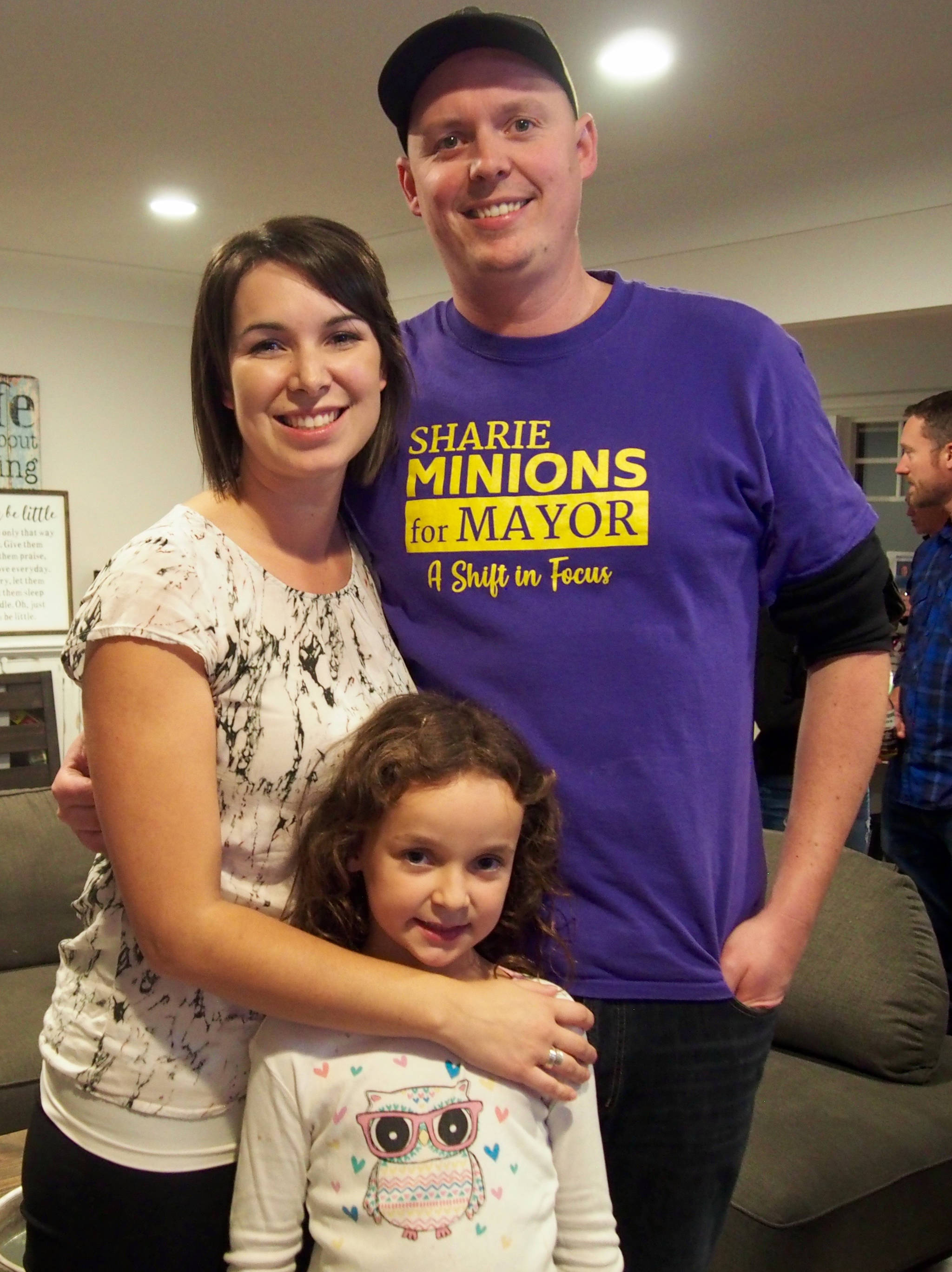 Sharie Minions, her husband Colin and one of her daughters celebrate after the results were announced on Saturday night. MIKE YOUDS PHOTO