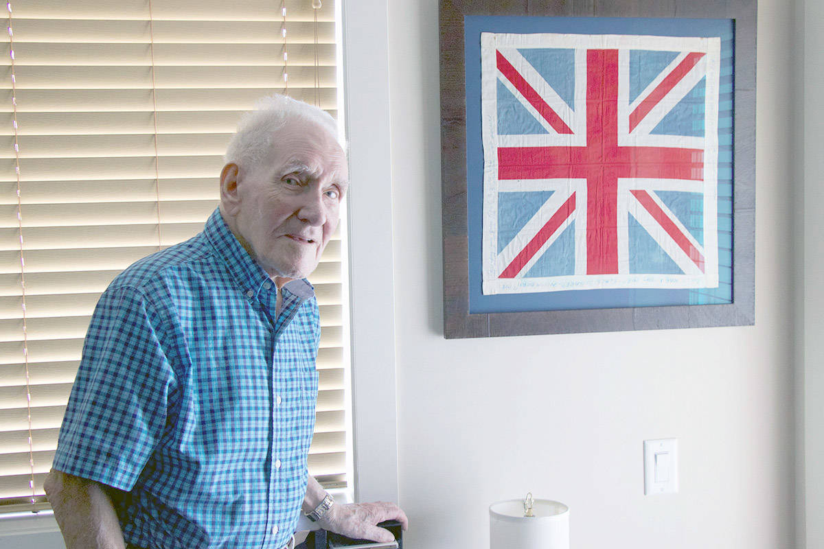 Roy Shopland and his prized 100-year-old Union Jack flag. (Brieanna Charlebois/Morning Star)