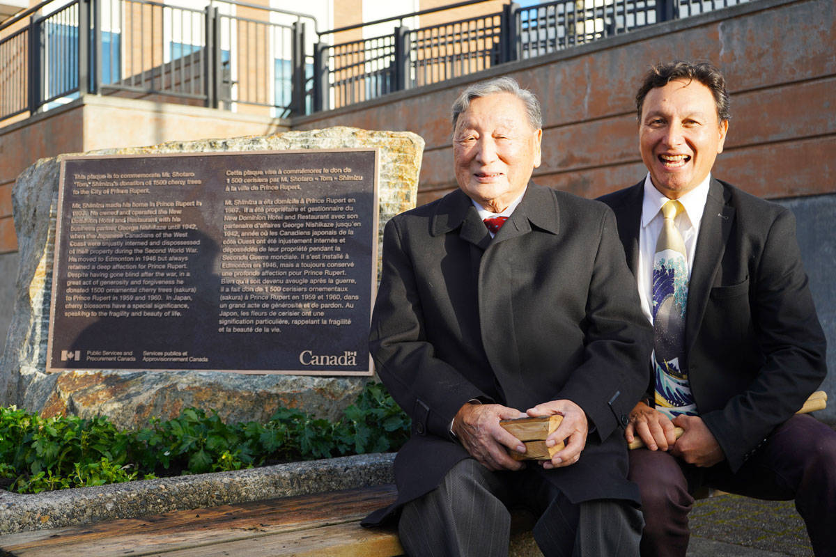 Henry Shimizu and his son Gregory at the newly installed monument dedicated to Shotaro Shimizu. (Shannon Lough / The Northern View)