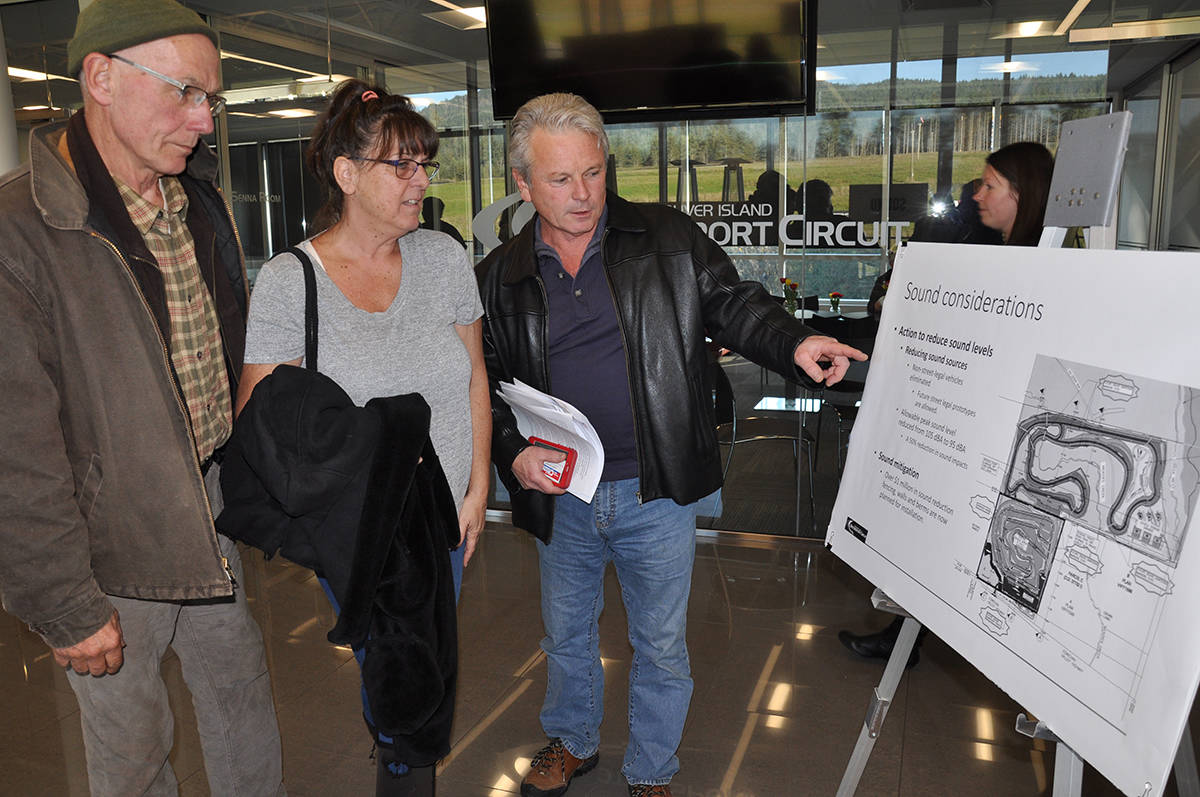 From left, Steve Jones, Katie Hartshorn and Dennis Del Torre look over expansion plans. (Warren Goulding/Citizen)