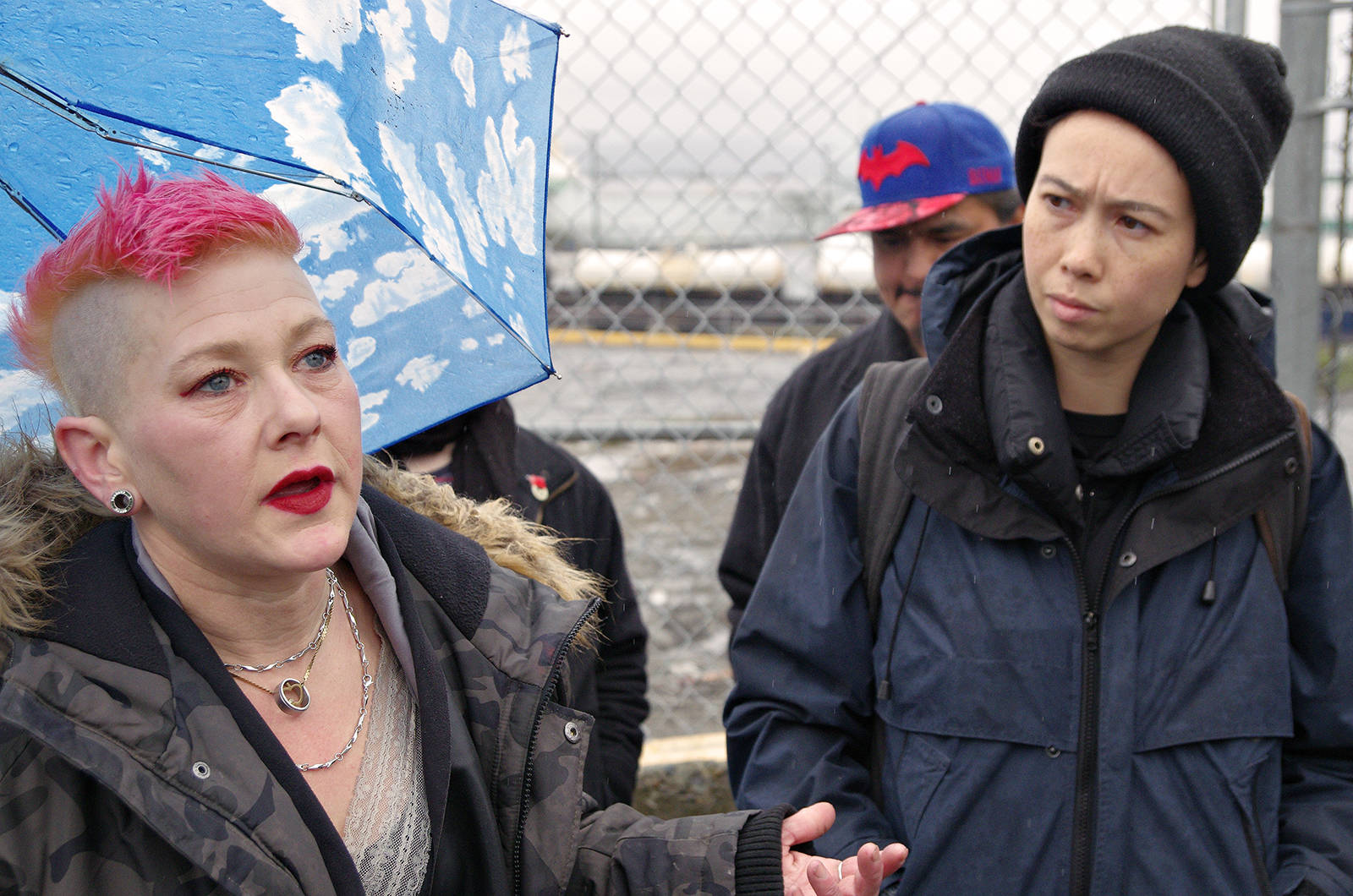 A former Discontent City resident who goes only by Ruby, left, describes her experiences at the tent city and its dismantling during a press conference organized by Alliance Against Displacement members including Listen Chen. CHRIS BUSH/ The News Bulletin