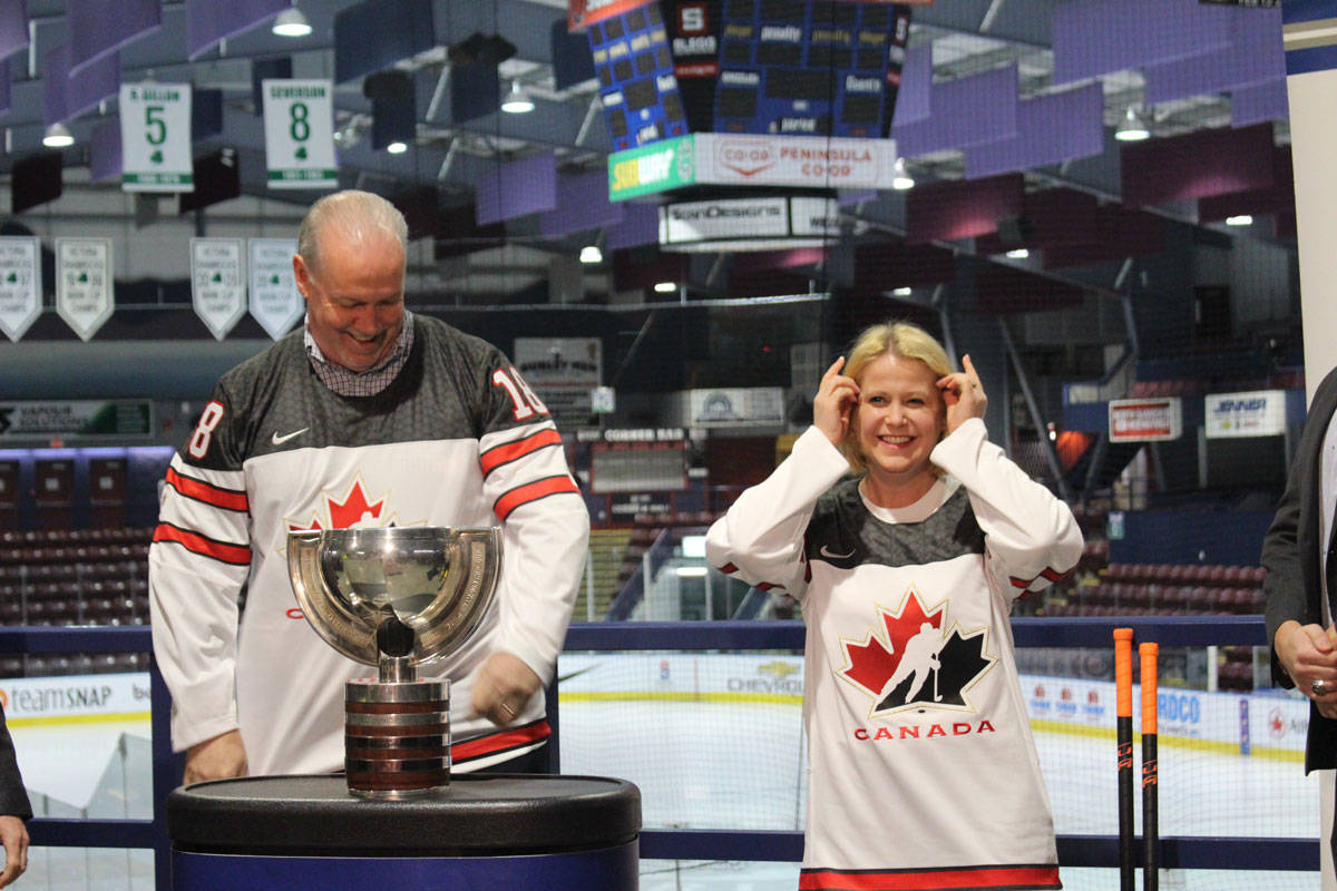 B.C. Premier John Horgan and Tourism Minister Lisa Beare try on their Team Canada jerseys before the selection camp kicked off at The Q Centre in Colwood Tuesday morning. (Shalu Mehta/News Staff)