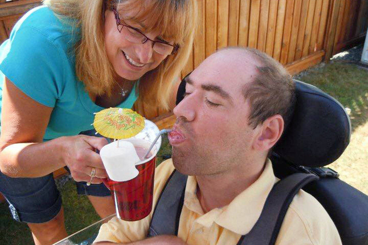 Scott Nesbitt requires a plastic, bendy straw to drink. (Carmell Nesbitt photo)