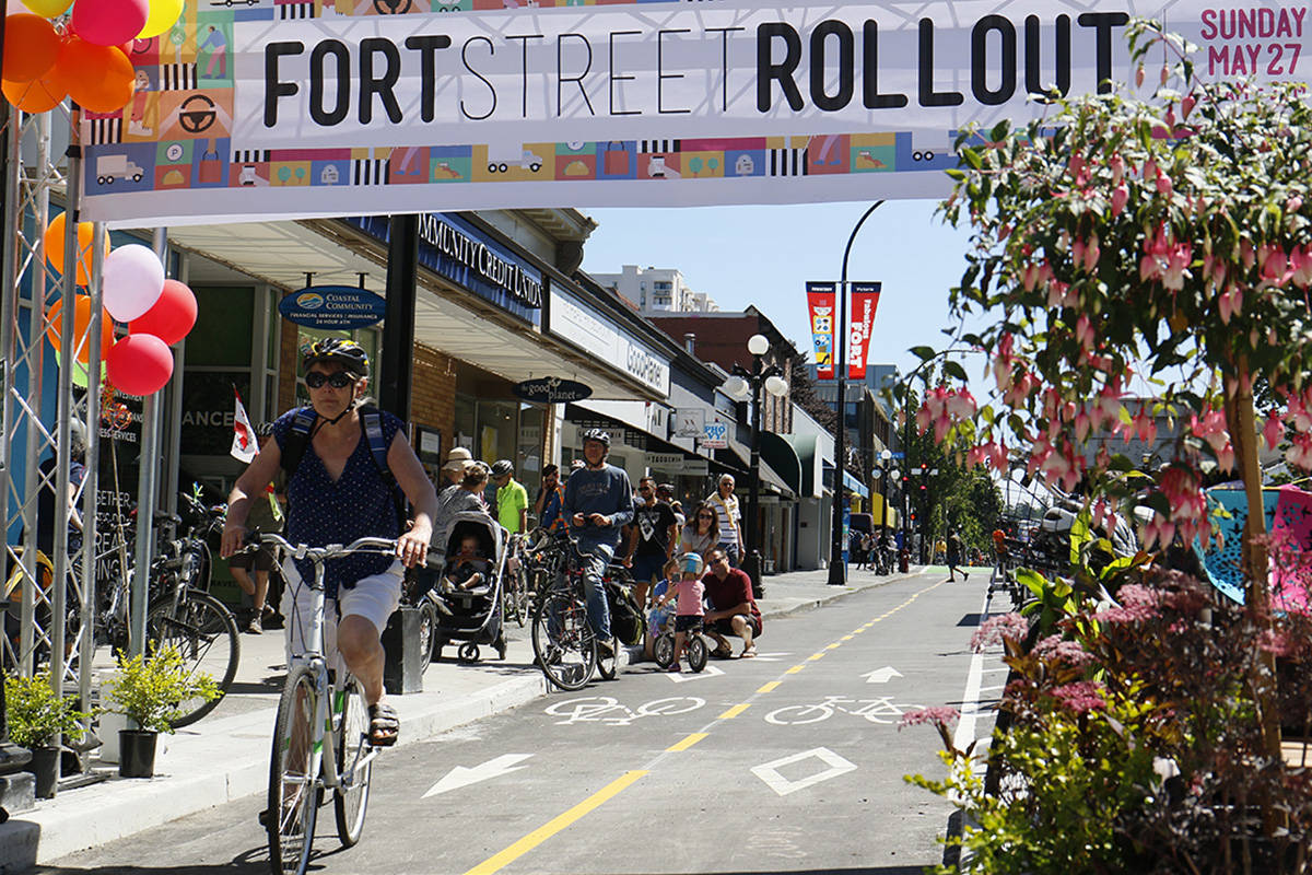 Cyclists of all ages and abilities gather on Fort Street to celebrate the official opening of the new dedicated, two-way, protected bike lanes. (File photo)
