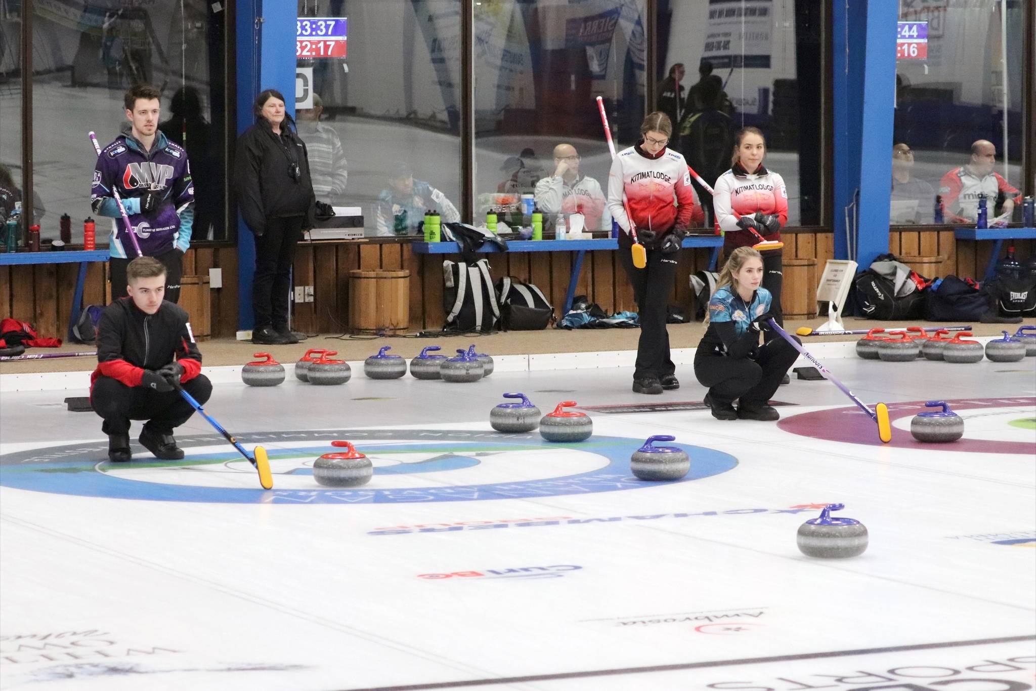 Vernon junior men’s skip Erik Colwell looks on as his team delivers a rock while Vernon junior women’s third Jaelyn Cotter does the same for her skip Megan McGillivray in Draw 2 action in Vernon on Thursday, Dec. 27, 2018. (John K. White/Morning Star)