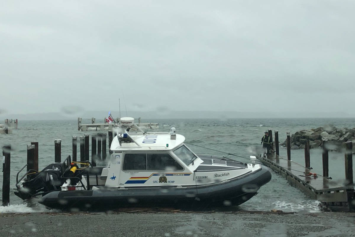 A routine servicing of a police boat turned slightly disastrous Thursday when a truck slipped off the boat ramp at Lochside Waterfront Park in Sidney. (Contributed by Sidney/North Saanich RCMP)