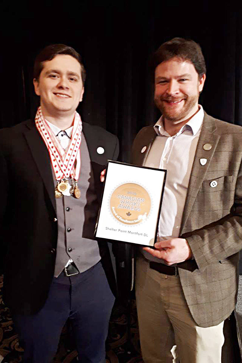Distillery manager Jacob Wiebe (left) and distiller Leon Webb accepted a crop of prizes at the Canadian Whisky Awards in Victoria on Jan. 18. Photo courtesy Shelter Point Distillery