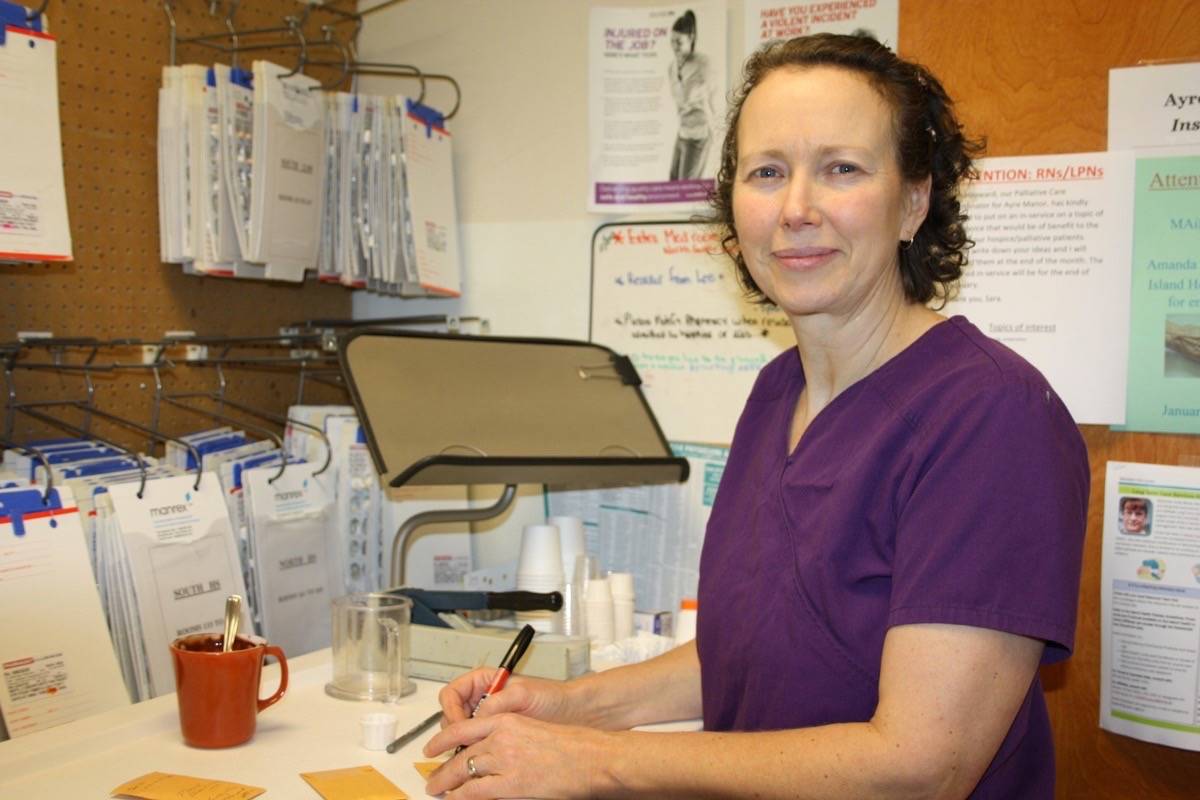 Eva Wiercinski, LPN, works to provide resident care at Ayre Manor. Nursing staff shortages at the facility have caused the administrators of the Manor to try a novel approach to recruitment. (Tim Collins/Sooke News Mirror)