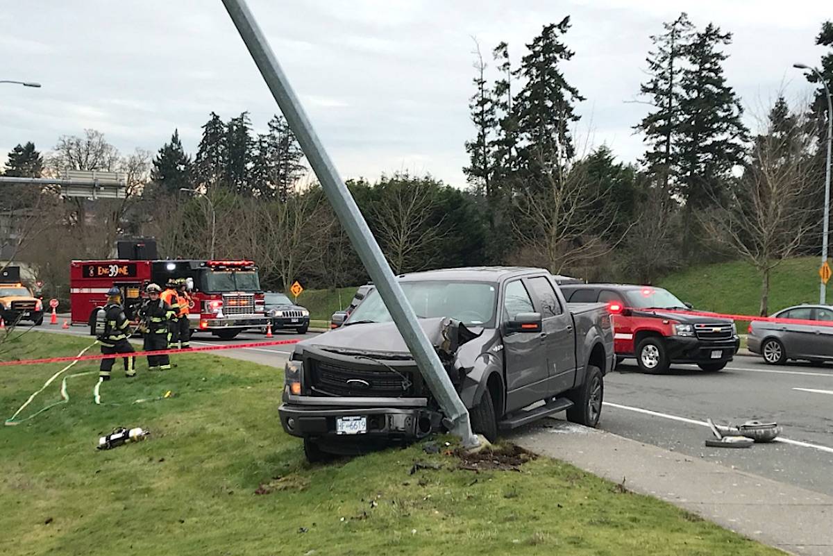 A man crashed a truck into a light standard at the Helmcken Road Park and Ride Thursday morning before fleeing in a canoe in Portage Inlet. (Keri Coles/News staff)