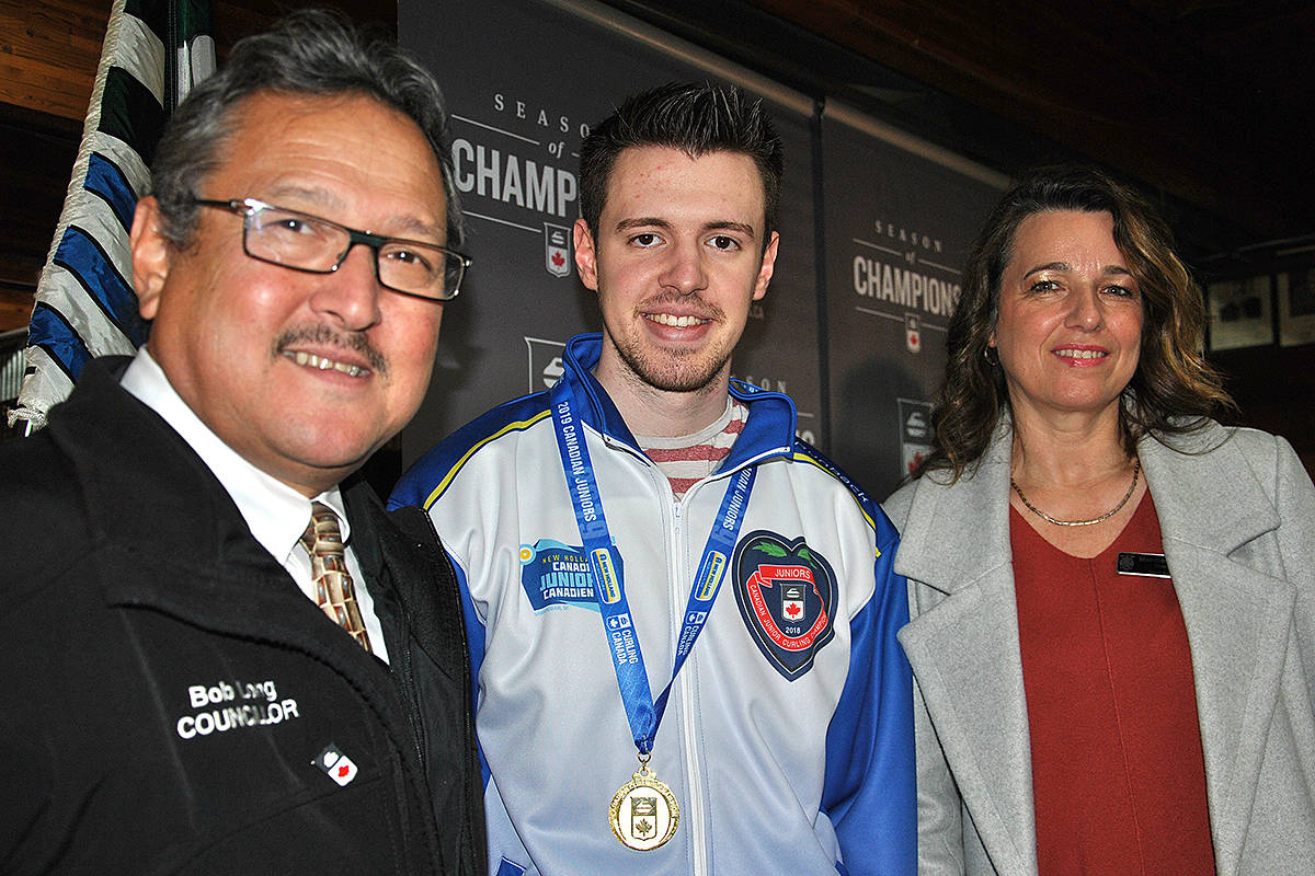 Langley Township Councillors Bob Long and Margaret Kunst flanked provincial, national, and global junior champion Tyler Tardi, who curls out of the Langley Curling Centre. The trio were on hand for Thursday’s announcement that Langley will be hosting the 2020 junior nationals. (Roxanne Hooper/Black Press)
